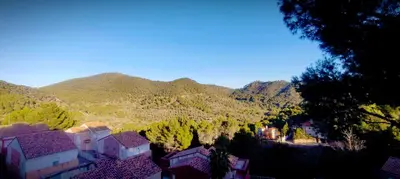 a view of a village with mountains in the background at Apartamento en la montaña, Serra in Serra