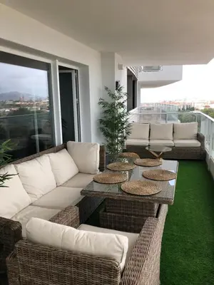 a living room with a couch and a table at Apartment Gran Canet by GRENT in Canet de Berenguer