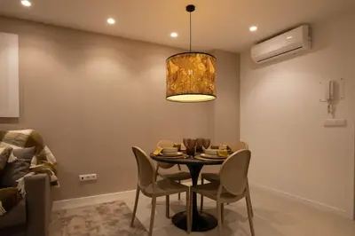 a dining room with a table and chairs at Dorm4You Centro in Valencia