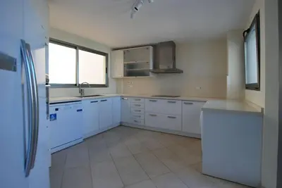 a kitchen with white cabinets and white appliances at Beautiful villa spectacular sea view in Faro de Cullera