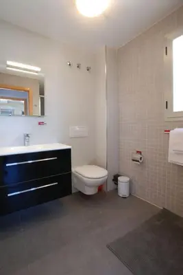 a bathroom with a toilet and a sink at Beautiful villa spectacular sea view in Faro de Cullera