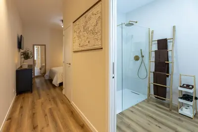 a bathroom with a shower with a glass door at Pivote Flats - Marina B in Valencia