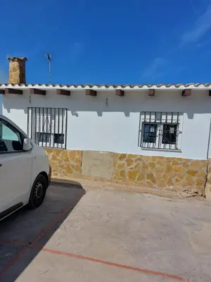a white car parked in front of a building at les berreries in Montroy