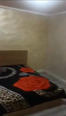 a bedroom with a bed with a blanket on it at Juan in Carlet