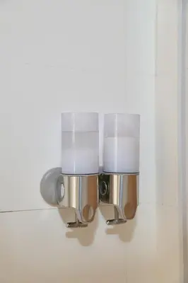 a light fixture on a wall in a bathroom at Apartamento de diseño en Plaza del Carmen F4 in Valencia