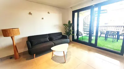 a living room with a couch and a table at BEACH VALENCIA LUXURY D9-29 Apartment with terrace and sea views with two rooms in Valencia