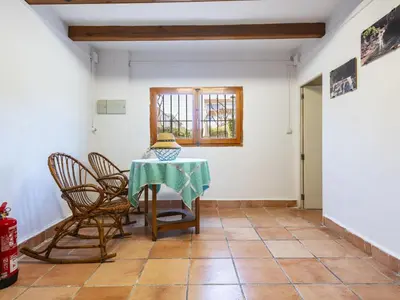 a room with a table and chairs and a window at Holiday Home D'estiu by Interhome in El Grao