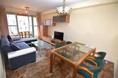 a living room with a couch and a table at MUY BIEN SITUADO LAS CIENCIAS n in Valencia