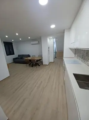 a living room with a couch and a table at Apartamento Turístico en Valencia in Valencia