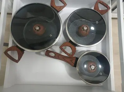 a group of three pots sitting on a shelf at Apartamento Turístico en Valencia in Valencia