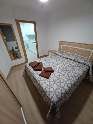 a bedroom with a bed with two pillows on it at Apartamento Turístico en Valencia in Valencia