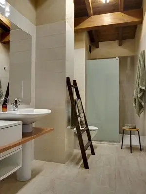 a bathroom with a sink and a toilet at Casa rural Puchero y Manta in Alcudia de Veo