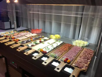 a buffet line with many different types of food at Masía De Lacy in Museros