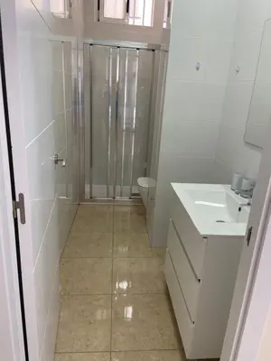 a bathroom with a shower and a toilet and a sink at Casa Valencia in Valencia
