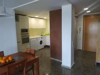 a kitchen with a table and a dining room at Desconexión y Relax in Mareny Blau