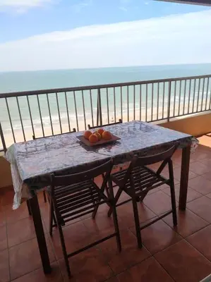 a table with a plate of fruit on a balcony at Desconexión y Relax in Mareny Blau