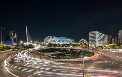 a busy city street at night with cars at Mediterraneum Apto E in Valencia