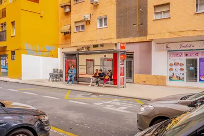 a group of people sitting in a gas station at Mediterraneum Suite D in Valencia