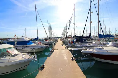 a bunch of boats docked in a harbor at Global Vacacional, Apartamento con terraza de 70m y piscina en Canet de Berenguer in Canet de Berenguer