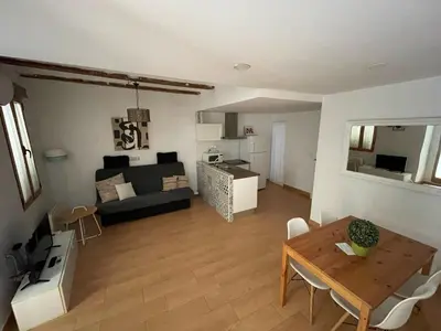a living room with a table and a couch at Apartamento centro histórico in Valencia