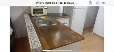 a kitchen with a wooden counter top with a sink at Apartamento centro histórico in Valencia