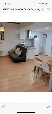 a living room with a couch and a table at Apartamento centro histórico in Valencia