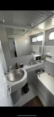 a small bathroom with a sink and a toilet at Barco Apartamento Playa Valencia in Valencia