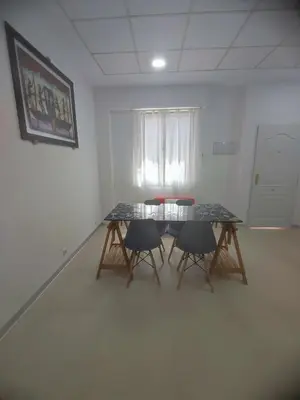 a room with a table and two chairs in it at Valencia Beach RED in Valencia
