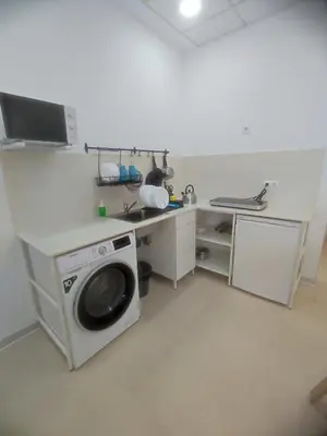a kitchen with a washing machine and a sink at Valencia Beach RED in Valencia