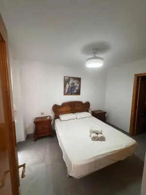 a bedroom with a bed with two towels on it at Apto 3 habitaciones, vistas al mar Moncofar Grao in Moncófar