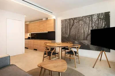 a kitchen and dining room with a table and chairs at Apartamentos Maestro Sosa in Valencia
