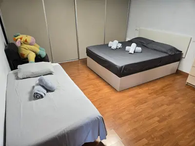 two beds with stuffed animals on them in a room at Chalet con piscina LUA HOME in Manises