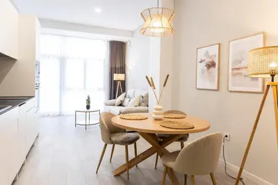 a kitchen and living room with a table and chairs at Favara Suites A by Concept Flats in Valencia
