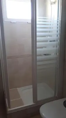 a shower with a glass door in a bathroom at BRISA de MAR in Moncófar