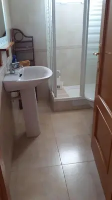 a bathroom with a white sink and a shower at BRISA de MAR in Moncófar