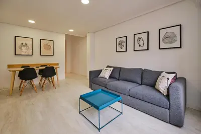 a living room with a couch and a table at PATRAIX FLAT in Valencia