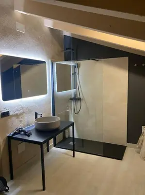 a bathroom with a sink and a mirror at Amazing suite by the fair in Valencia