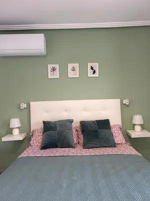 a bedroom with a large bed with two pillows at Sea view apartment, first line on the beach, Remote work in Canet de Berenguer