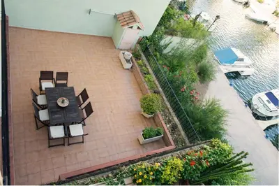 an overhead view of a patio with a table and chairs at Apartamento 1 linea mar terraza Port Saplaya in Port Saplaya