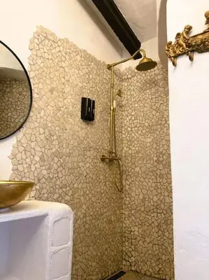 a bathroom with a shower with a sink and a mirror at Villa Torre, Valencia Spanje in Macastre