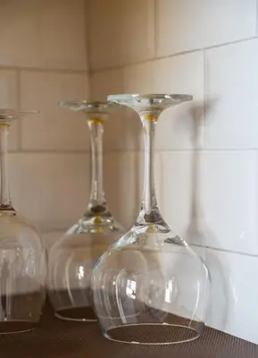 three empty wine glasses sitting on a table at Loft Industrial Doble Altura in Valencia