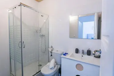 a bathroom with a shower and a toilet and a sink at at Maestro Gozalbo, Ruzafa in Valencia