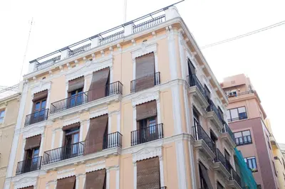 a tall building with balconies on the side of it at Living Valencia Apartments - Merced in Valencia