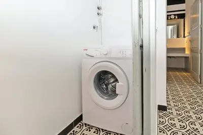 a washer and dryer in a laundry room at GuestReady - A perfect stay in Ciutat Vella in Valencia