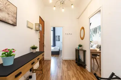 a living room with a table and a tv at Mestalla Apartment Ideal for Mid-Term Stays in Valencia
