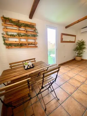 a room with two benches and a table and a window at Aire in Valencia