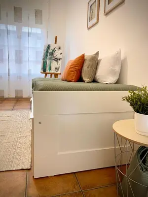 a couch with pillows on it in a room at Tierra in Valencia