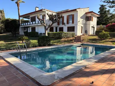 a swimming pool in front of a house at Mediterranean House in Valencia in Valencia