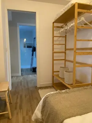 a bedroom with a bunk bed and a room with a doorway at El refugio del mar in Playa de Mar