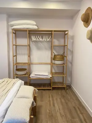 a bedroom with a bunk bed and wooden shelves at El refugio del mar in Playa de Mar